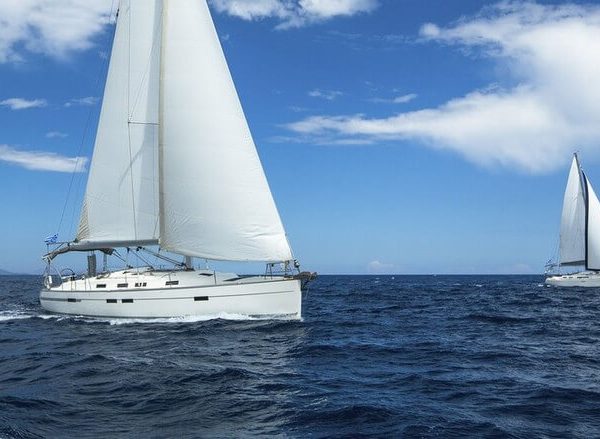 Two charter yachts sailing on open water