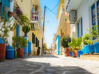 Kardamena,Greece,21.08.2021.Typical Greek street with summer flowers. Kos island. Kardamena. Greece.