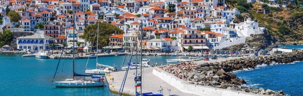 Skopelos town spilling down the hillside to the harbour