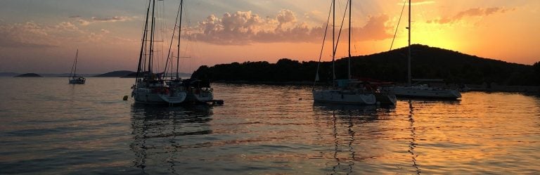 Yachts at anchor at sunset among the Dalmatian islands