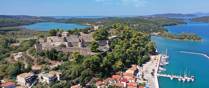 Aerial drone photo of iconic medieval castle built in small hill overlooking city of Vonitsa, Ambracian gulf, Greece