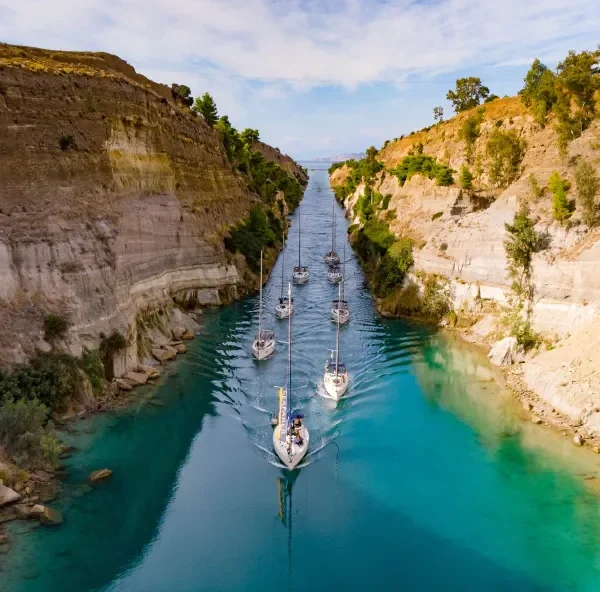 Flotilla yachts motoring through the Corinth Canal
