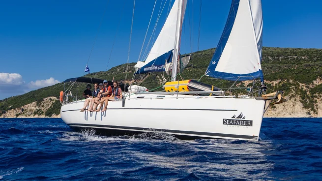 An RYA instructor coaching students on a Seafarer Training yacht