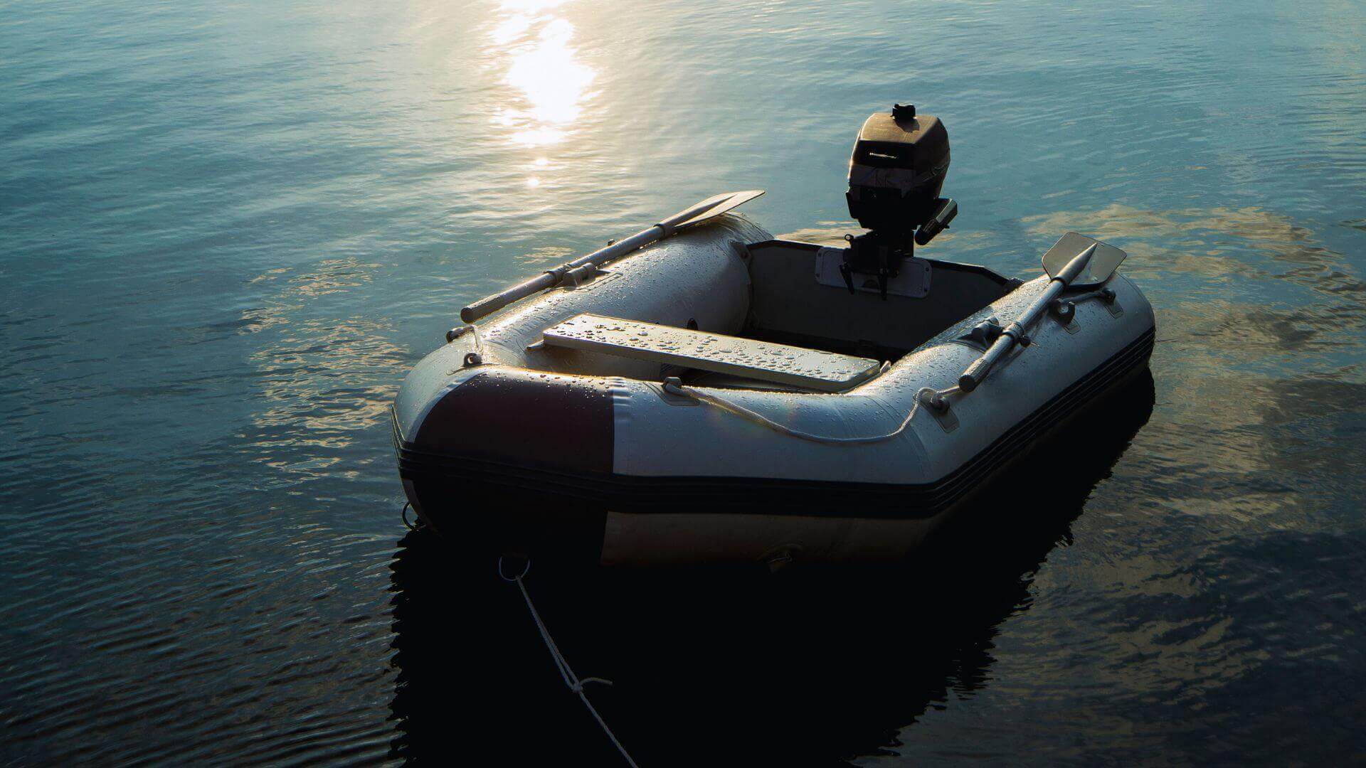 An inflatable dinghy with an outboard motor floating on calm water at sunset, highlighting practical yacht charter tips for safety.