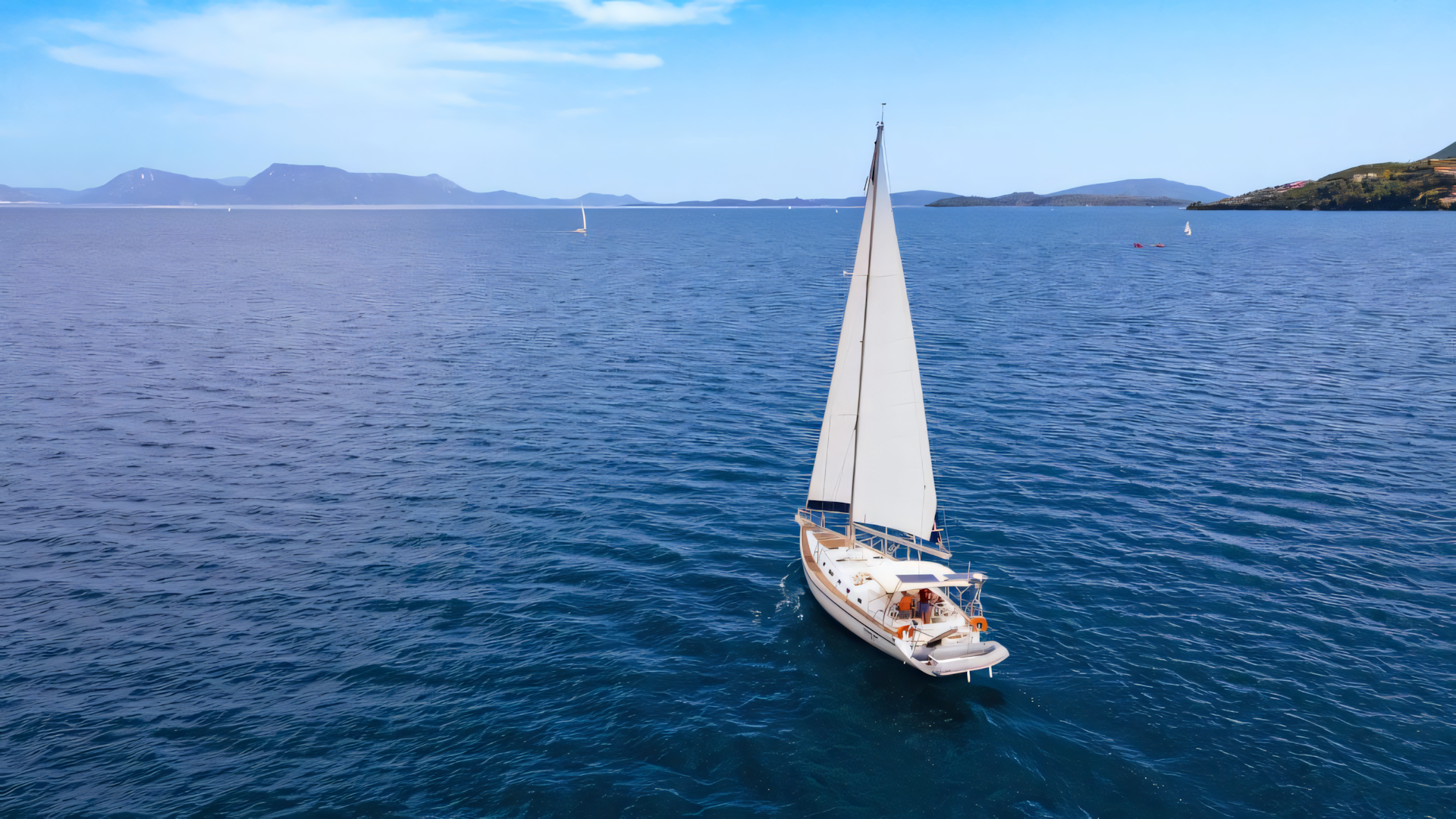 A Seafarer sailing yacht gliding through the calm waters of Greece, showcasing eco-friendly travel and sustainable holidays in Greece.