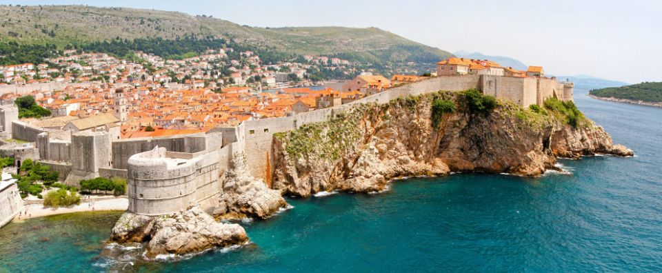 Dubrovnik’s historic city walls overlooking the Adriatic Sea, a must-visit on Dalmatian Coast sailing holidays