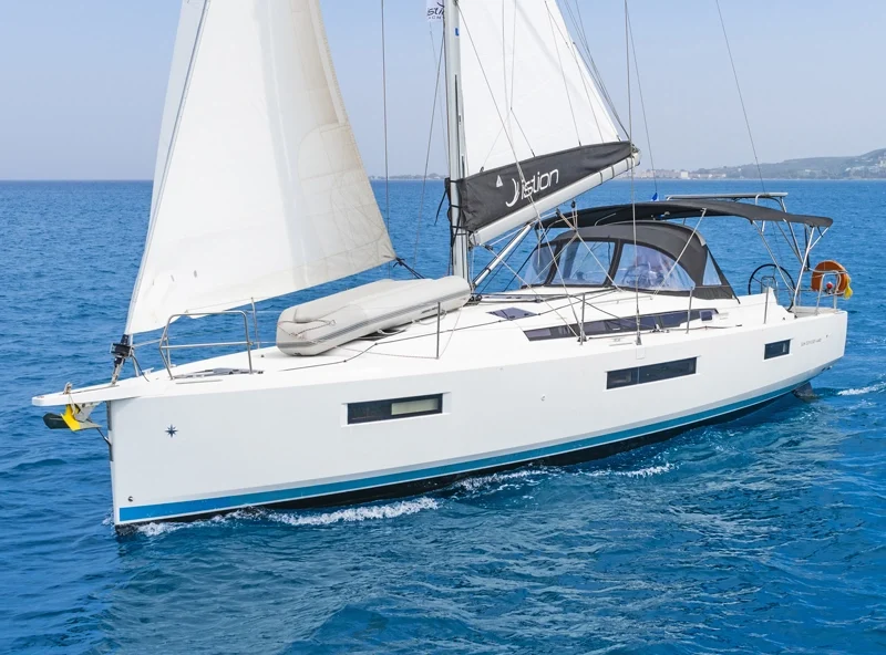 A Sun Odyssey 440 sailing on a blue sea