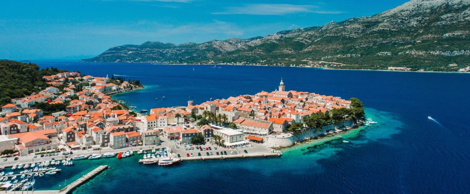 The charming medieval town of Korčula, surrounded by the Adriatic Sea and lush vineyards on the Dalmatian coast.