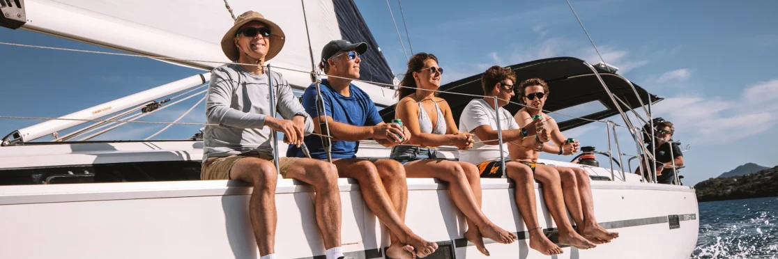 AHOY guests sitting together on deck while sailing in the Ionian
