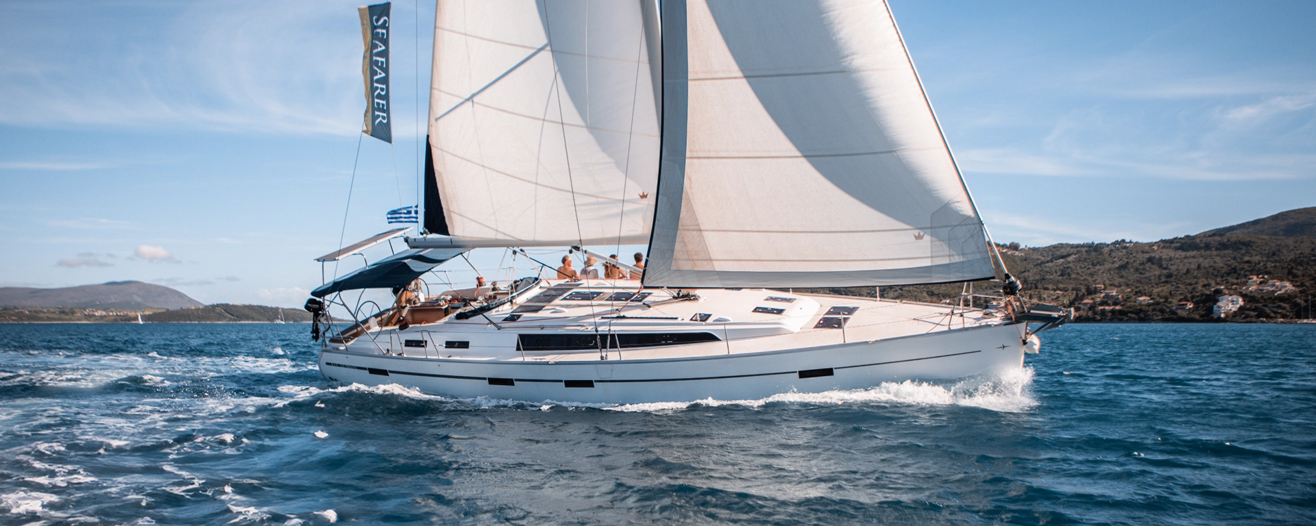 Our AHOY Ionian yacht under sail with guests on deck