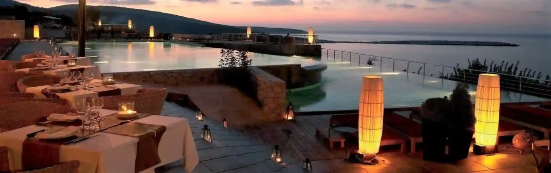 Dining terrace and infinity pool at Emelisse Resort, Kefalonia