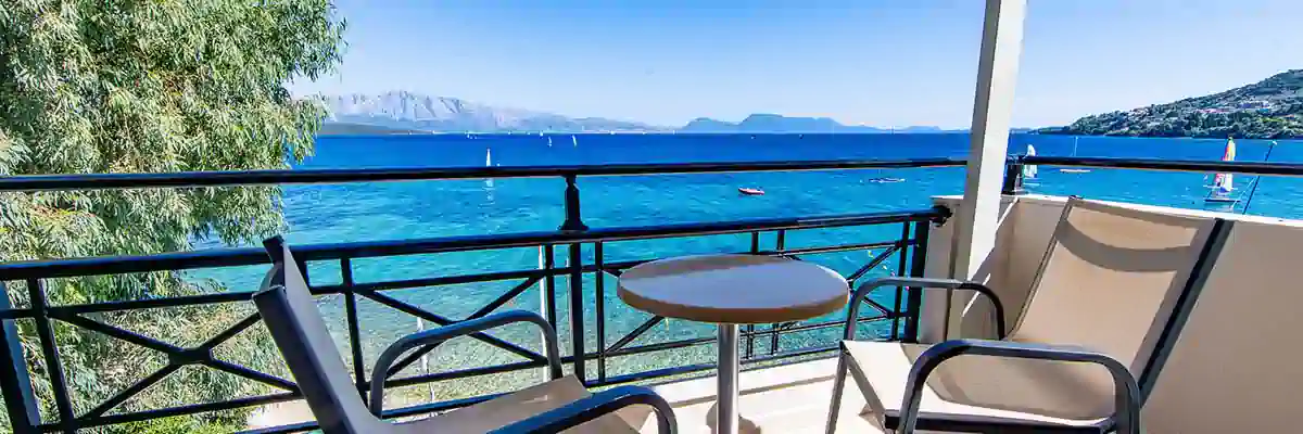 Seafront balcony view from a room at Nikiana Beach Club in Greece – Seafarer Sailing holidays