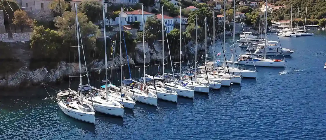 A small flotilla of yachts moored side by side in Greece