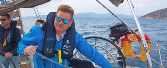 A student at the helm during an RYA Day Skipper course in Croatia