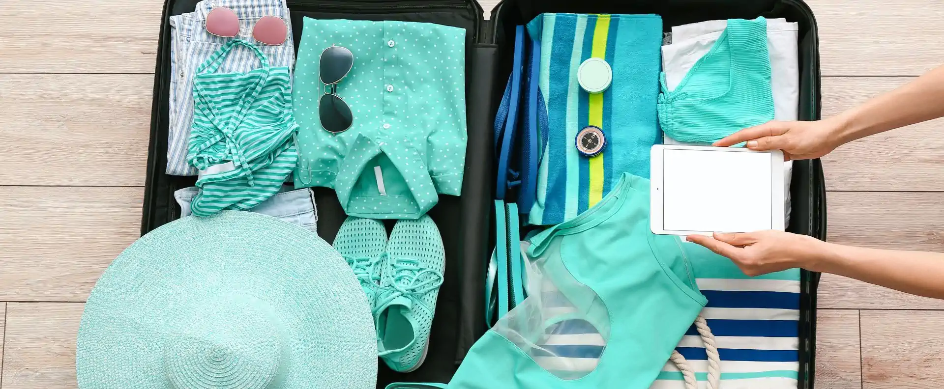 sailing blogs packing tips for yacht holiday Flat lay of essential clothing and accessories packed for a Greek sailing holiday featured in Seafarer’s sailing blogs.