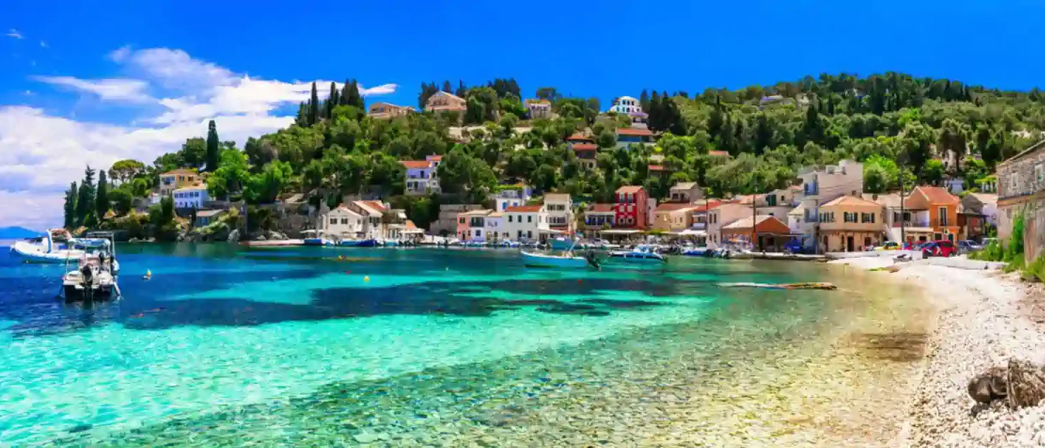 Paxos Lakka harbour with clear water and small boats, Ionian Greece