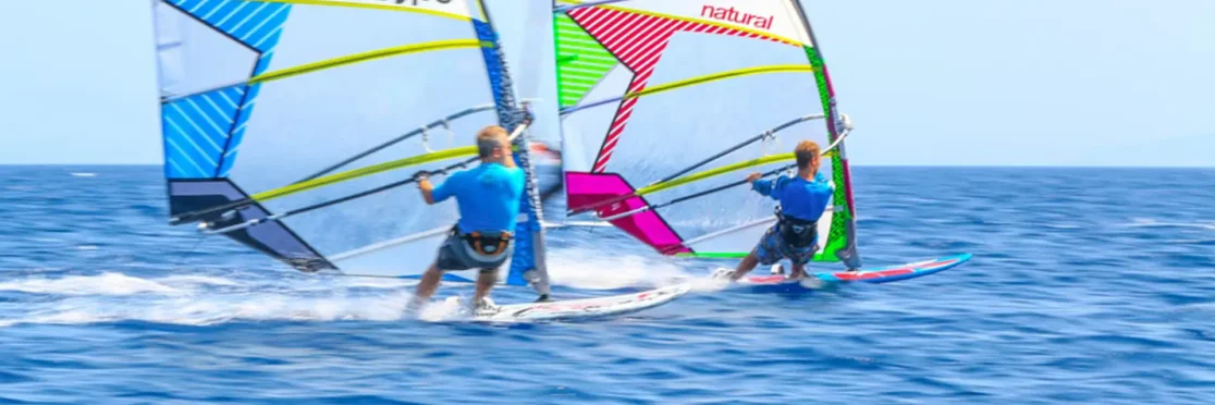 Windsurfer planing across Kefalos Bay