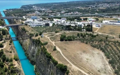 Aerial view of the Corinth Canal in Greece, showing the narrow waterway linking the Saronic and Corinthian gulfs.