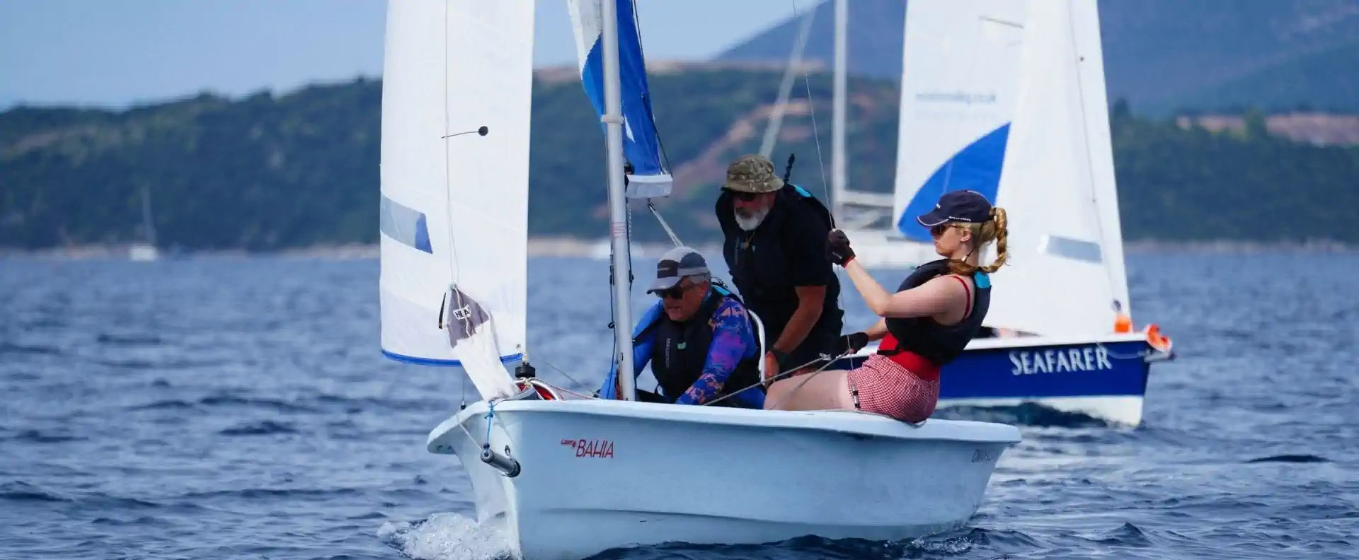 Seafarer guests sailing on a dinghy in Greece, sailing holidays Greece