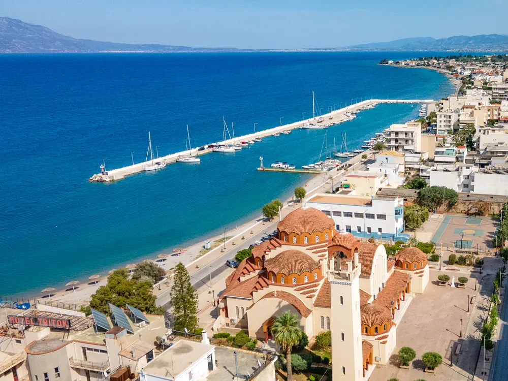 An aerial view of Kiato and its harbour on the Gulf of Corinth, the start of our Corinth flotilla