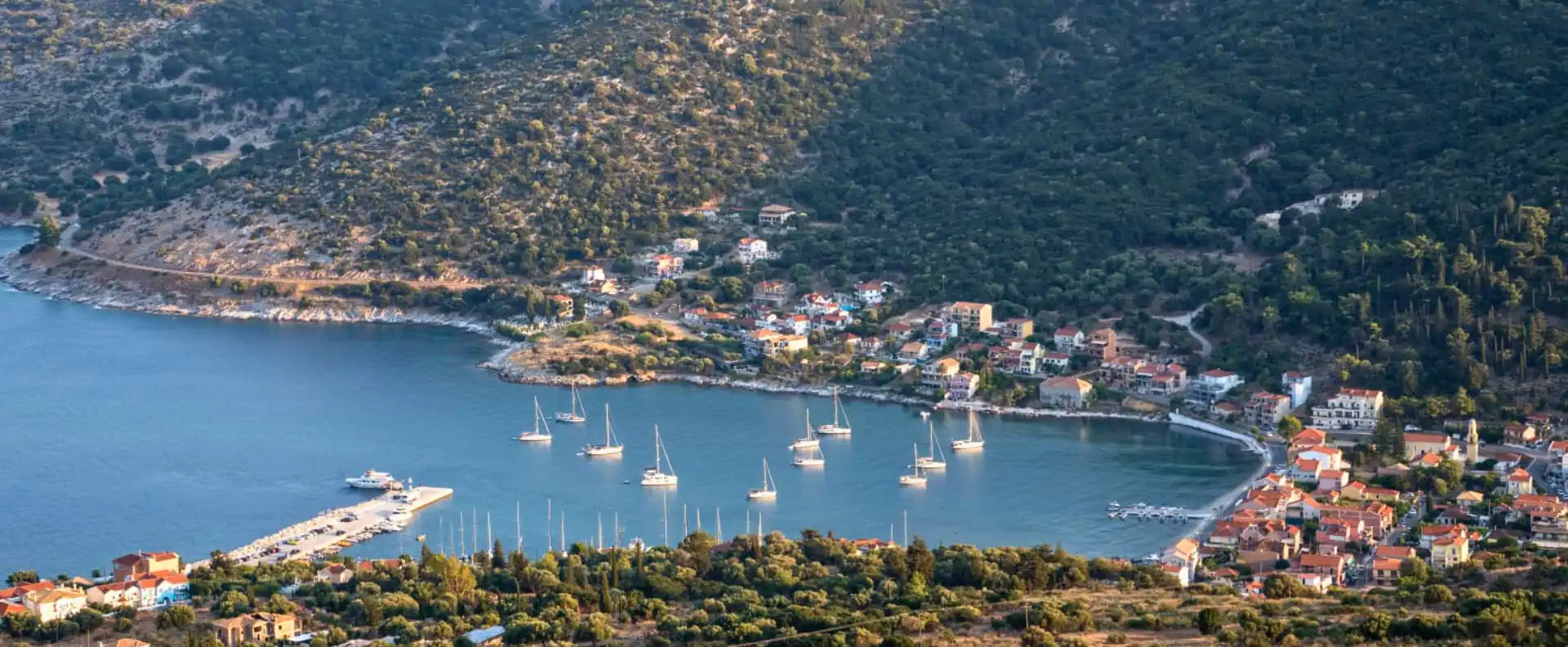 Flotilla yachts anchored in clear blue water while sailing around Kefalonia