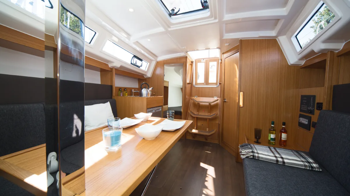 The saloon of a Bavaria Easy 9.7, looking aft