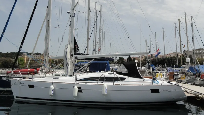 An Elan 444 Impression moored in a marina