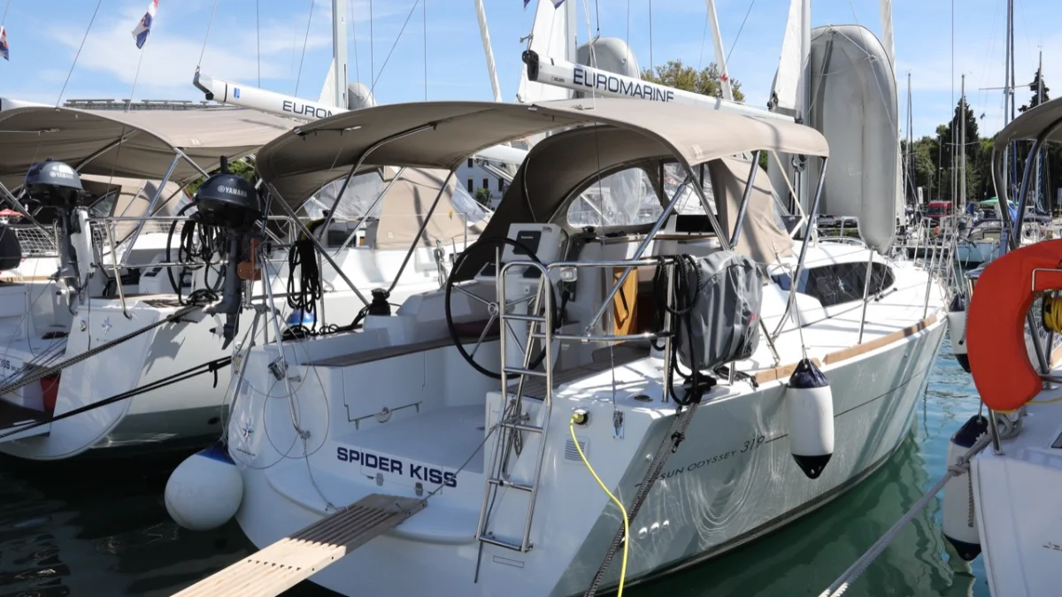 A Sun Odyssey 319 moored stern-to in a marina