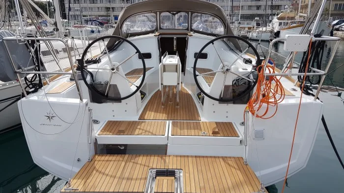 The cockpit and twin wheels of a Sun Odyssey 349