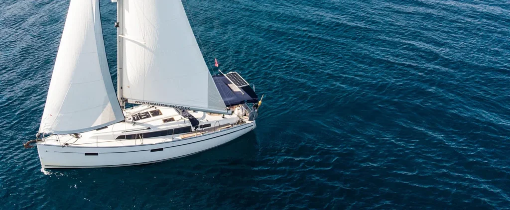 Sailing yacht under full sail on open water in Greece