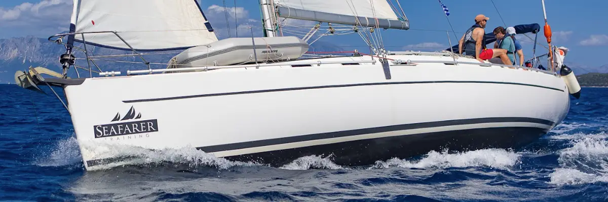 RYA Yachtmaster scheme training: students crewing a Seafarer training yacht under sail in Greece